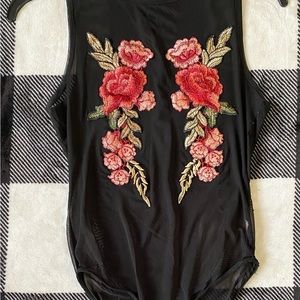 Women’s/Junior Bodysuit Size Large In The Color Black With Red And Green Flowers